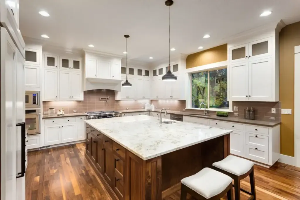 Wide shot kitchen with wood floors and jwhite cabinets - Enhancing Kitchen Functionality and Durability with CGS Quality Undermount Slides